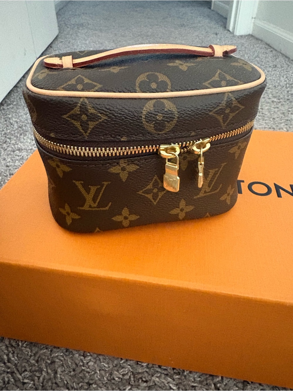Louis Vuitton Monogram Cosmetic Case in Beige with Gold Hardware.